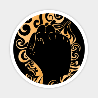 Raised fist in golden fire Magnet